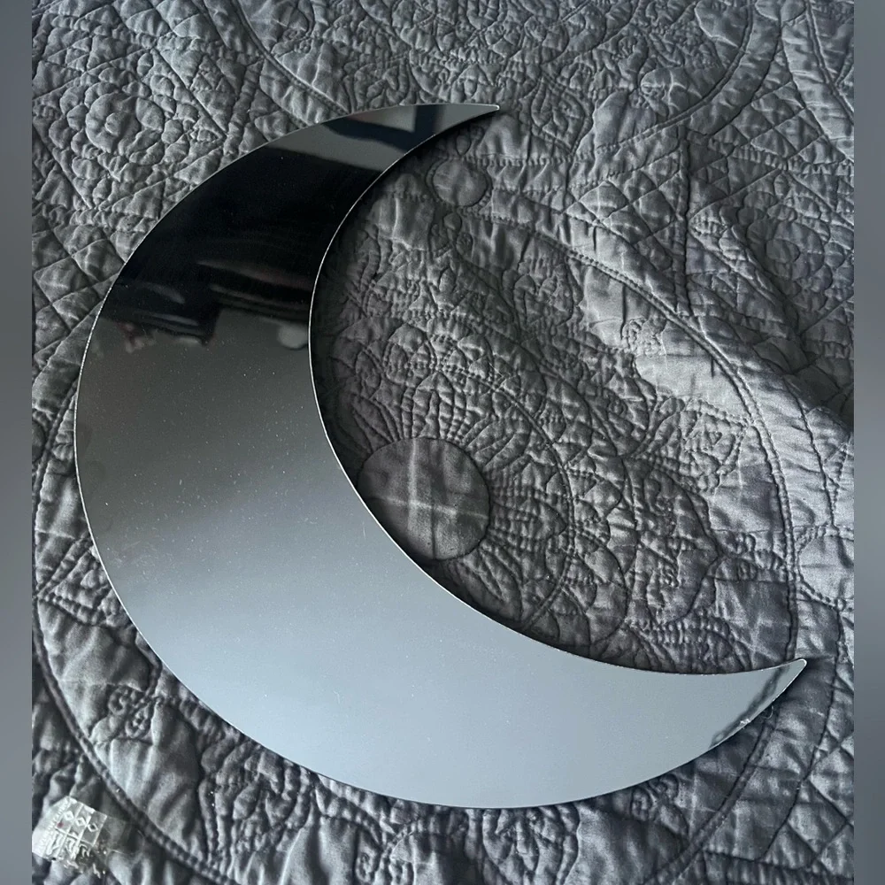 Crescent moon wall mirror, lightweight, great for an apartment or dorm.